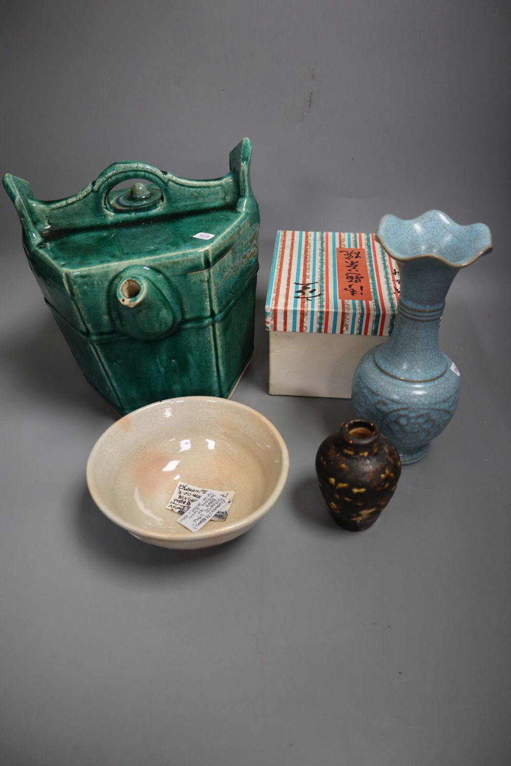 A Chinese green glazed teapot, 20.5cm high, a Cizhou type vase, a turquoise glazed vase and a Japanese tea bowl